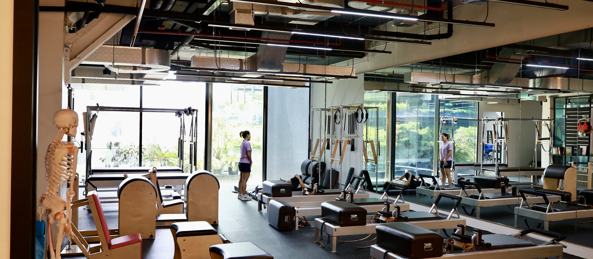 Full panoramic view of the RM58 Pilates studio with all Gratz apparatus visible